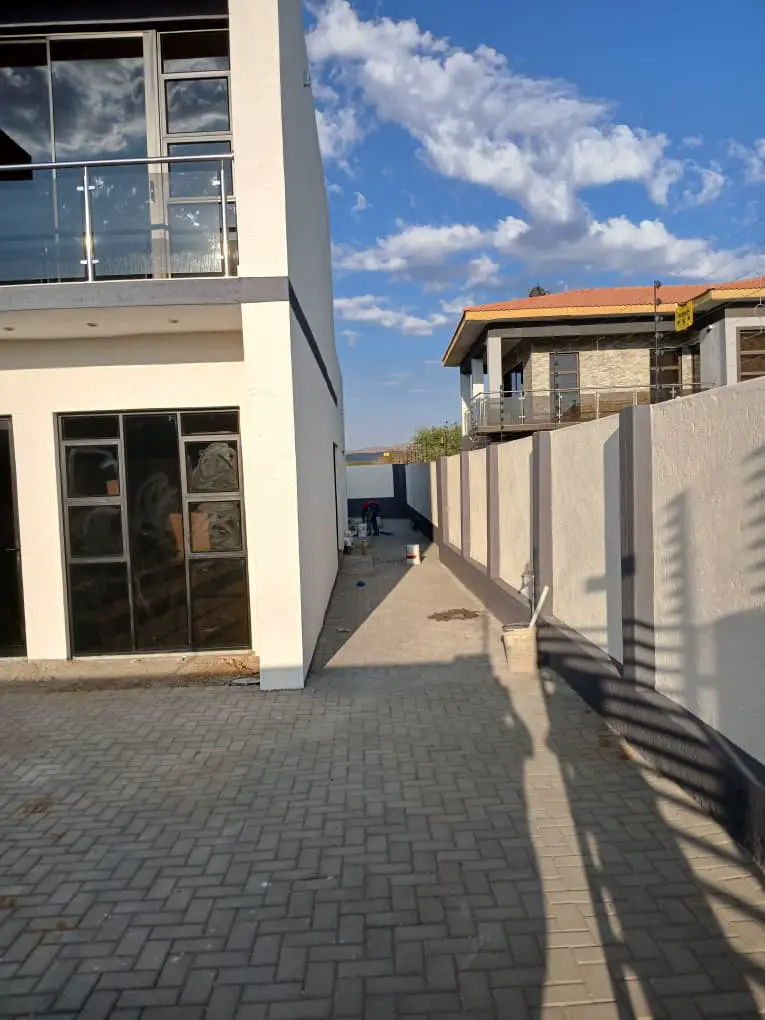 Outside: Paving along the boundary wall