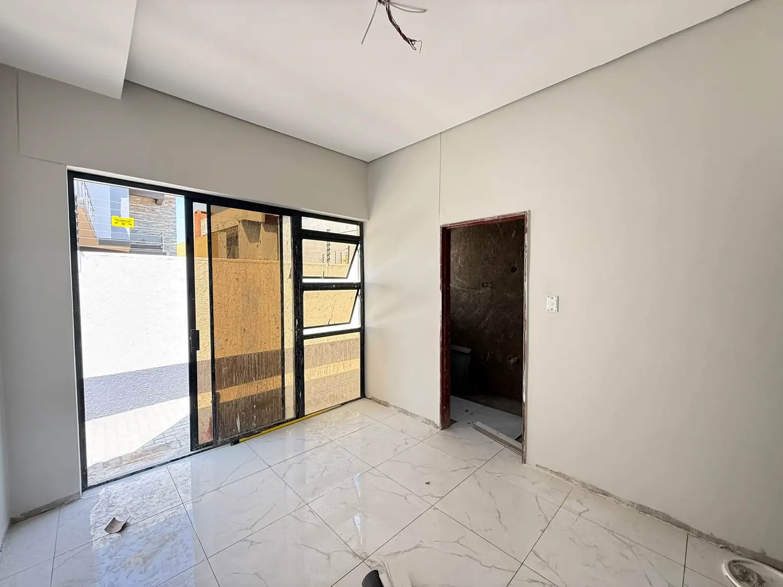 Ground floor: Room with sliding doors to the yard
